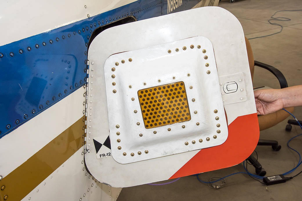 A photo of the conformal antenna installed on the door of T-34C aircraft. 