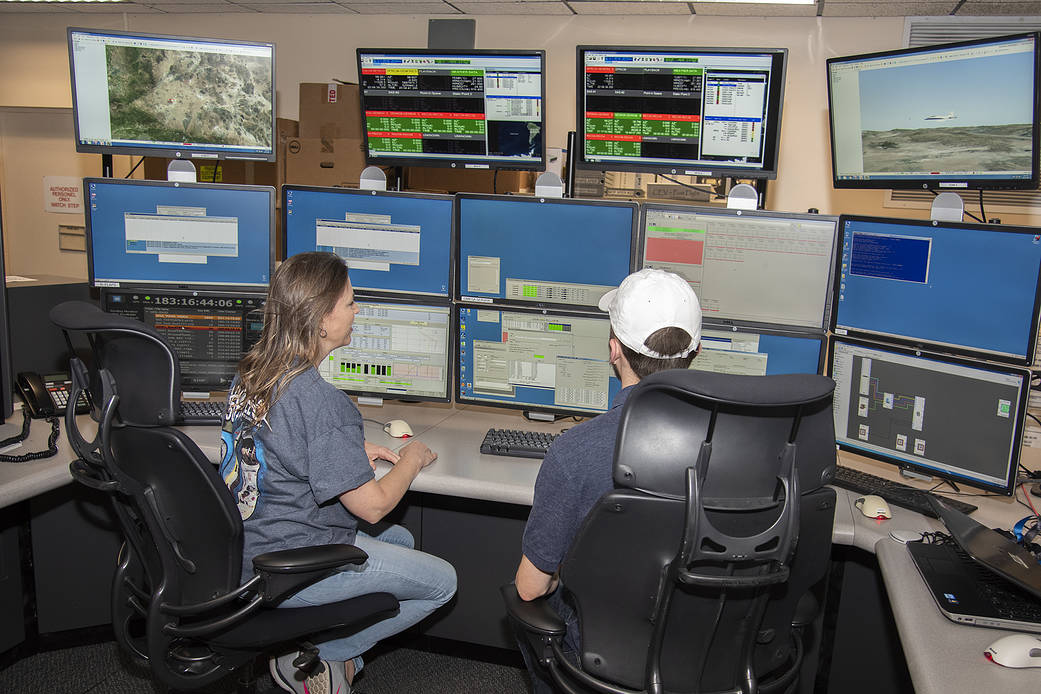 Sonja Belcher and Zach Springer at Telemetry and Radar Acquisition Processing System.
