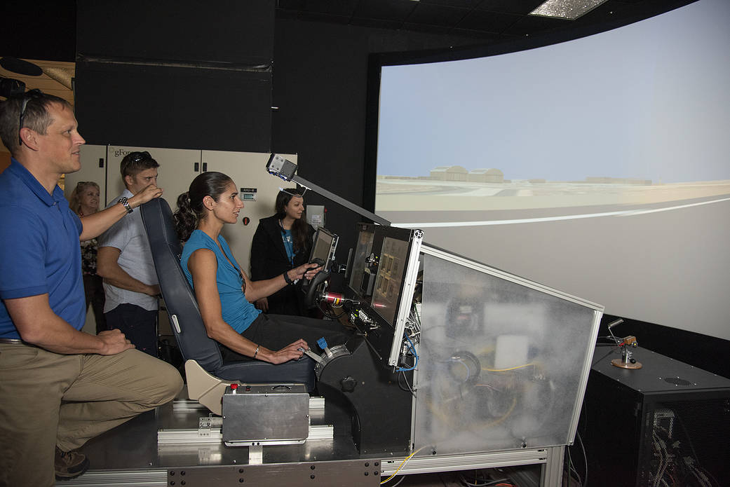 NASA's 2017 astronaut candidates practice flying in X-57 aircraft simulator at AFRC.