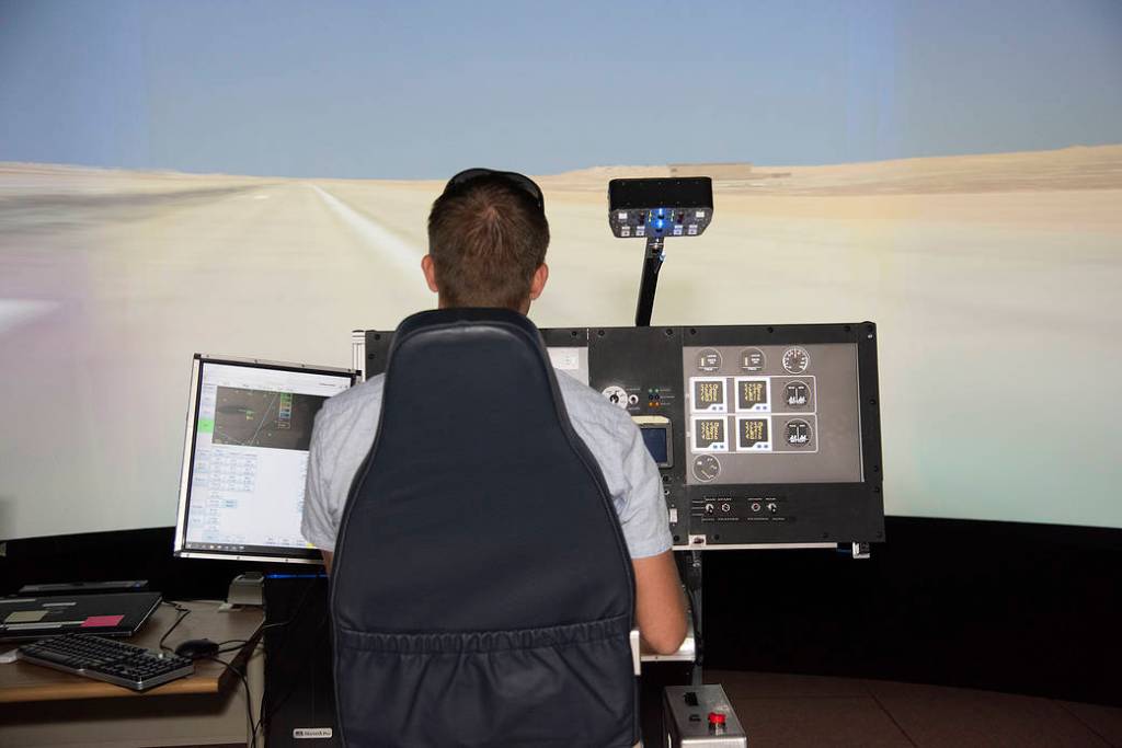 Astronaut Pilots X-57 Simulator at Armstrong Flight Research Center