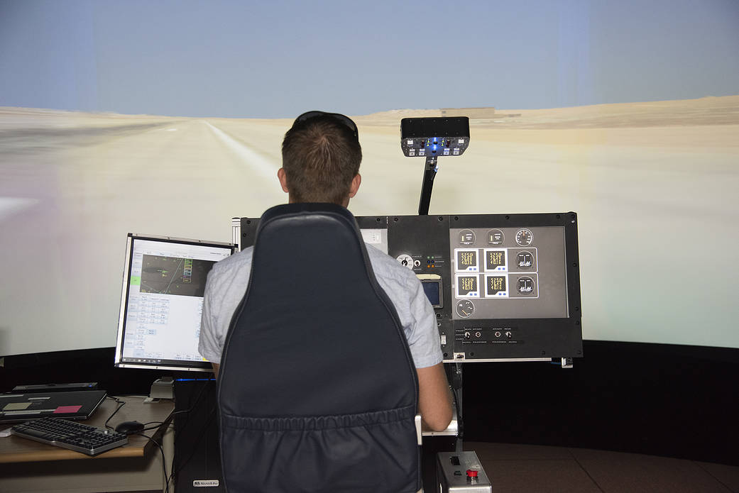 NASA's 2017 astronaut candidate Matthew Dominick practices flying in the X-57 aircraft simulator at Armstrong.
