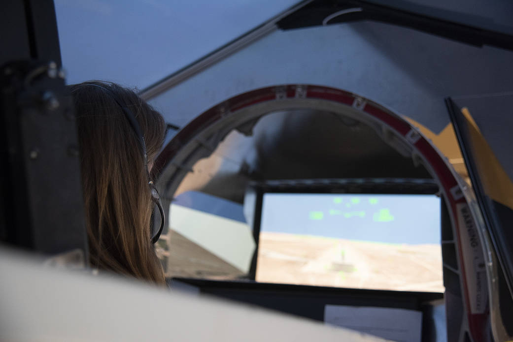 NASA's 2017 astronaut candidate Kayla Barron practices flying in an X-59 QueSST simulator at Armstrong Flight Research Center, i