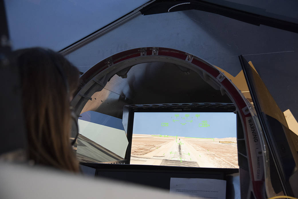 NASA's 2017 astronaut candidate Kayla Barron practices flying in an X-59 QueSST simulator at Armstrong Flight Research Center, 