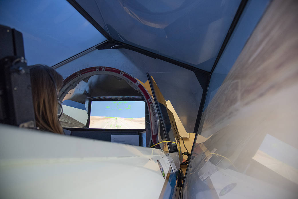 NASA's 2017 astronaut candidate Kayla Barron practices flying in an X-59 QueSST simulator at Armstrong Flight Research Center, i