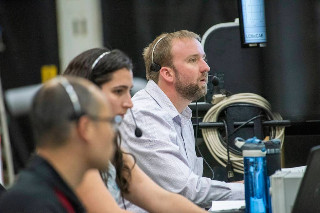 Wesley Li, Kirsten Boogaard and test conductor Eric Miller observe testing of the X-57 distributed electric aircraft wing.