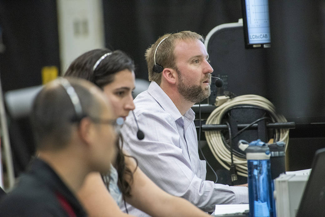 Wesley Li, Kirsten Boogaard and test conductor Eric Miller observe testing of the X-57 distributed electric aircraft wing.