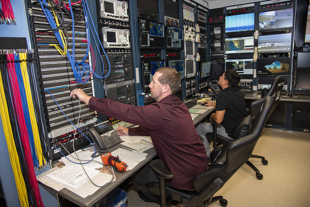 Jeff Koenig and Carlos Torres prepare to support the ISS and Soyus spacecraft.