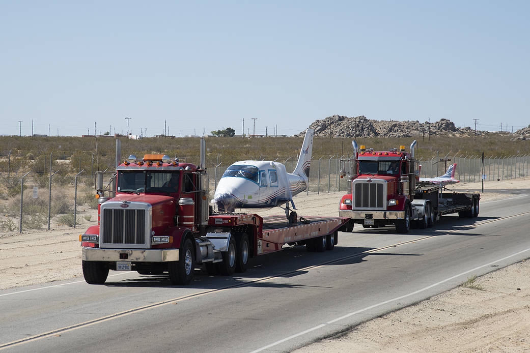 NASA’s all-electric X-57 Maxwell fuselage and wings are traveling on two separate truck beds.