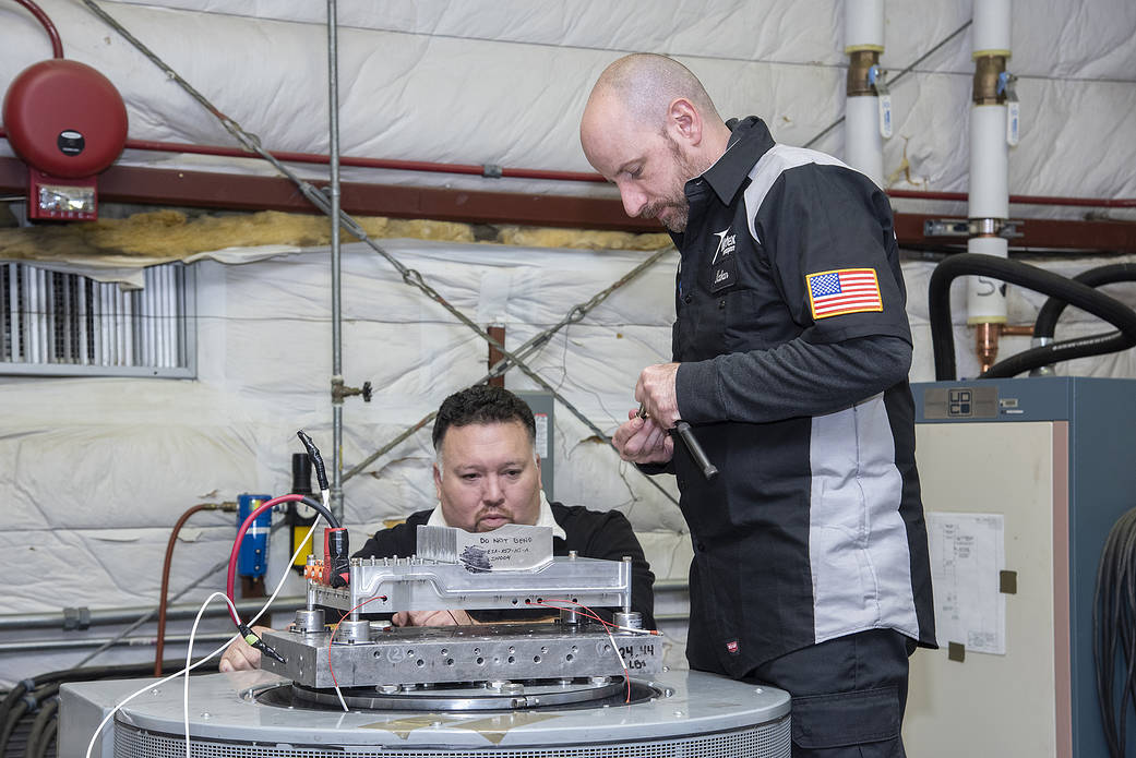 Engineers from NASA’s Armstrong Flight Research Center and Empirical Systems Aerospace prepare a cruise motor controller.