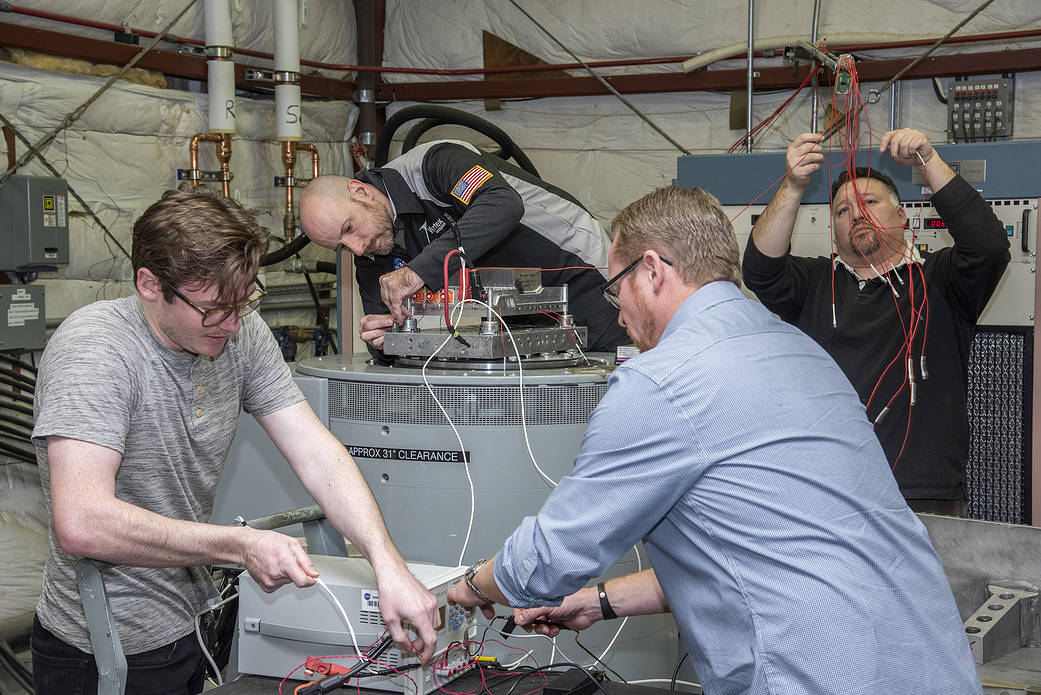 Engineers from NASA’s Armstrong Flight Research Center and Empirical Systems Aerospace prepare a cruise motor controller.