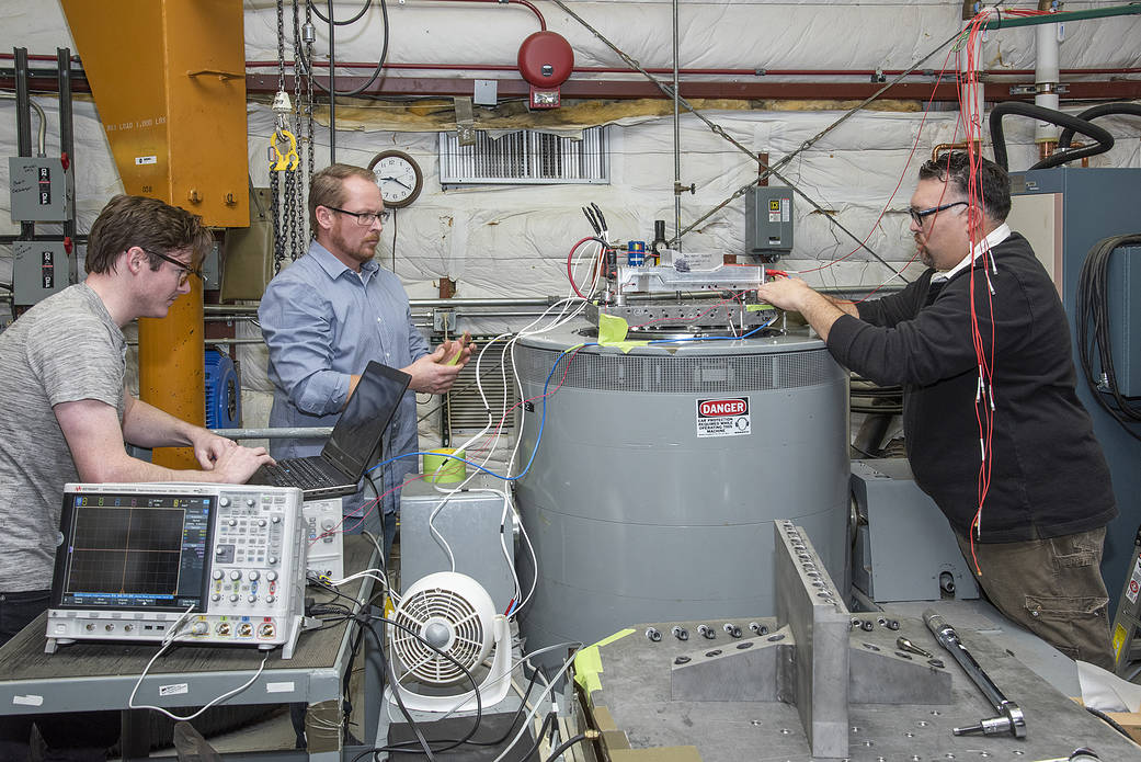 Engineers from NASA’s Armstrong Flight Research Center and Empirical Systems Aerospace prepare a cruise motor controller.