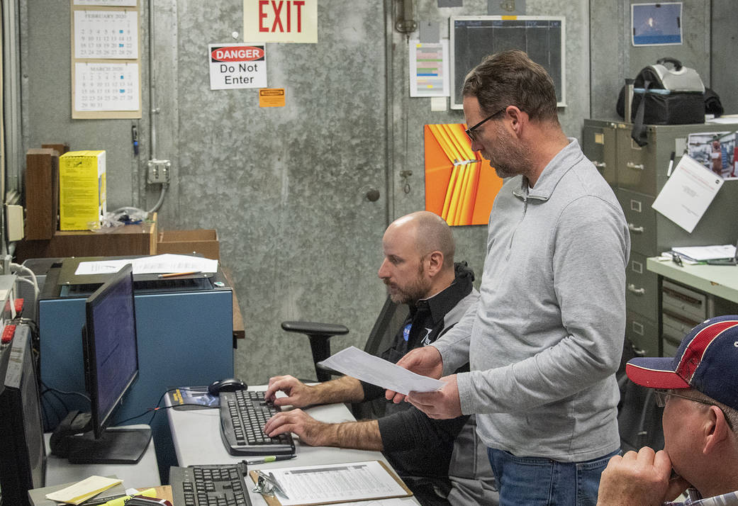 Engineers monitor data during vibration testing of a cruise motor controller for the X-57 Maxwell.