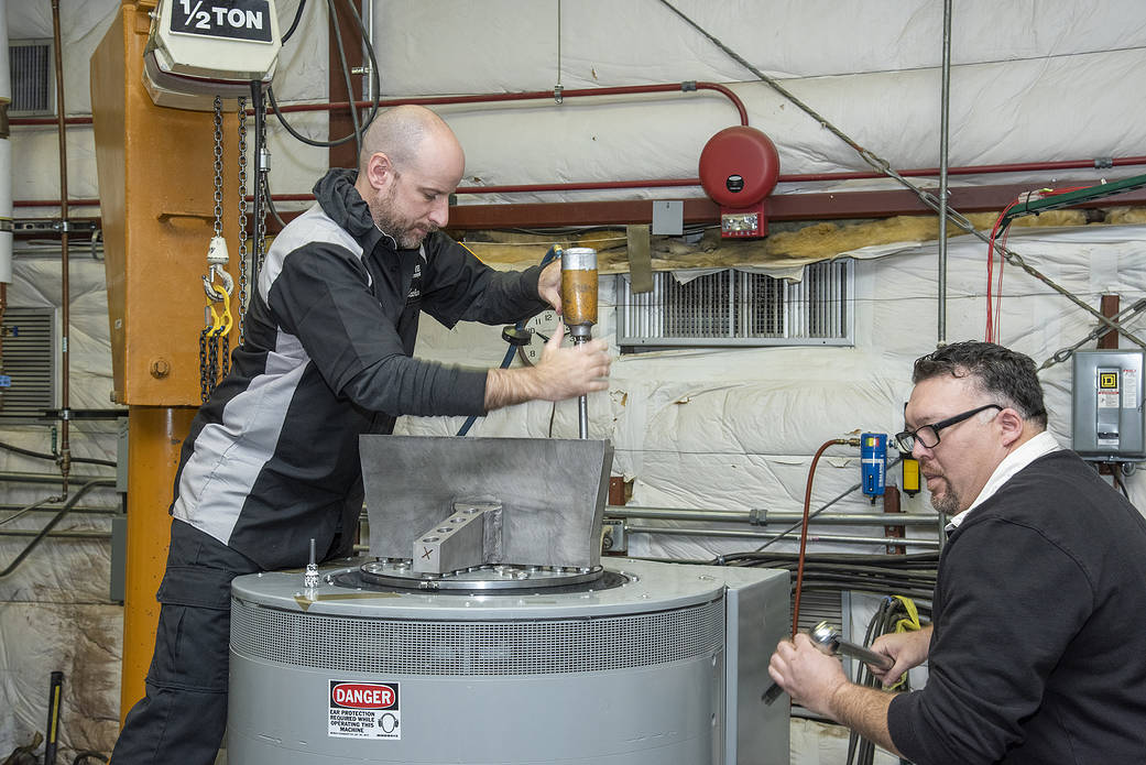 Engineers prepare a cruise motor controller, planned to be used on NASA’s all-electric X-57 Maxwell.