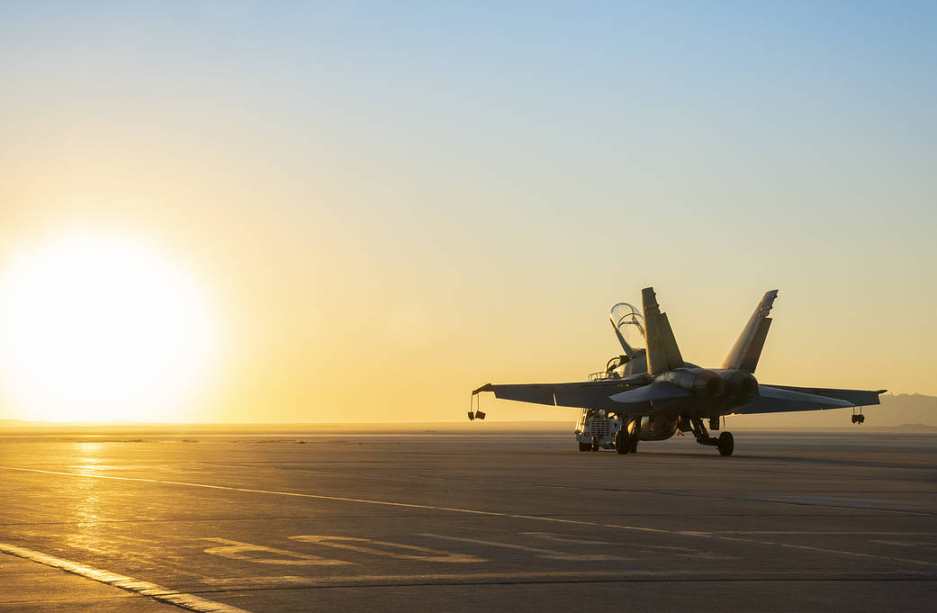 FA/18 being towed at sunrise