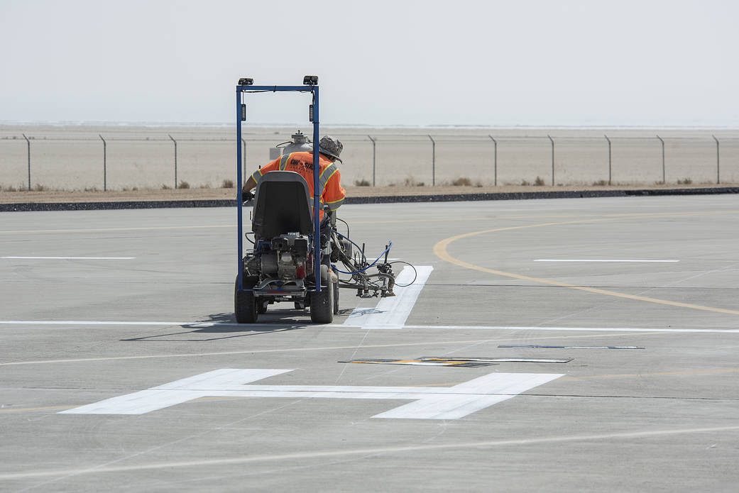 A worker painted vertiports and helipads at AFRC
