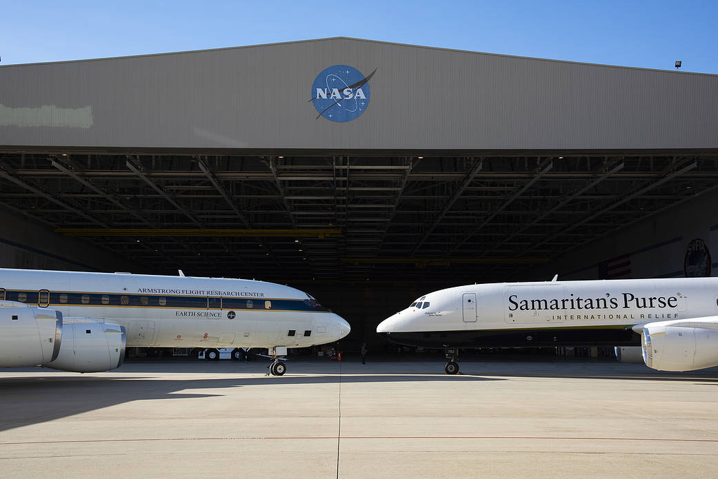 NASA and Samaritans Purse DC-8 aircrafts parked on the ramp in front of NASA’s Armstrong Flight Research Center Building 703.