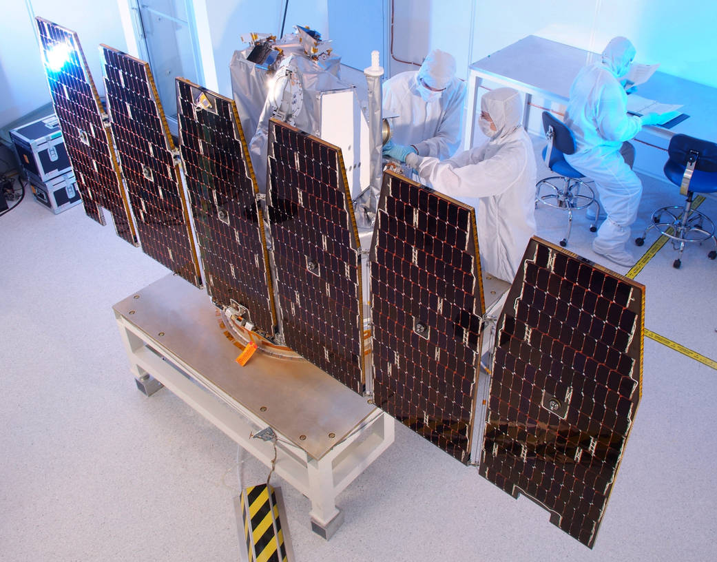 The AIM spacecraft undergoes solar array deployment tests.