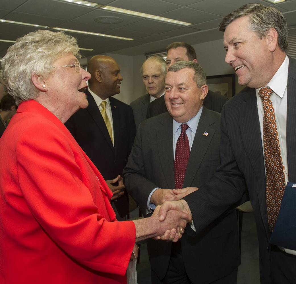 Alabama Lt. Gov. Kay Ivey, left, talks with Tony Jones, center, Boeing vice president and Huntsville, Ala., site executive, and 
