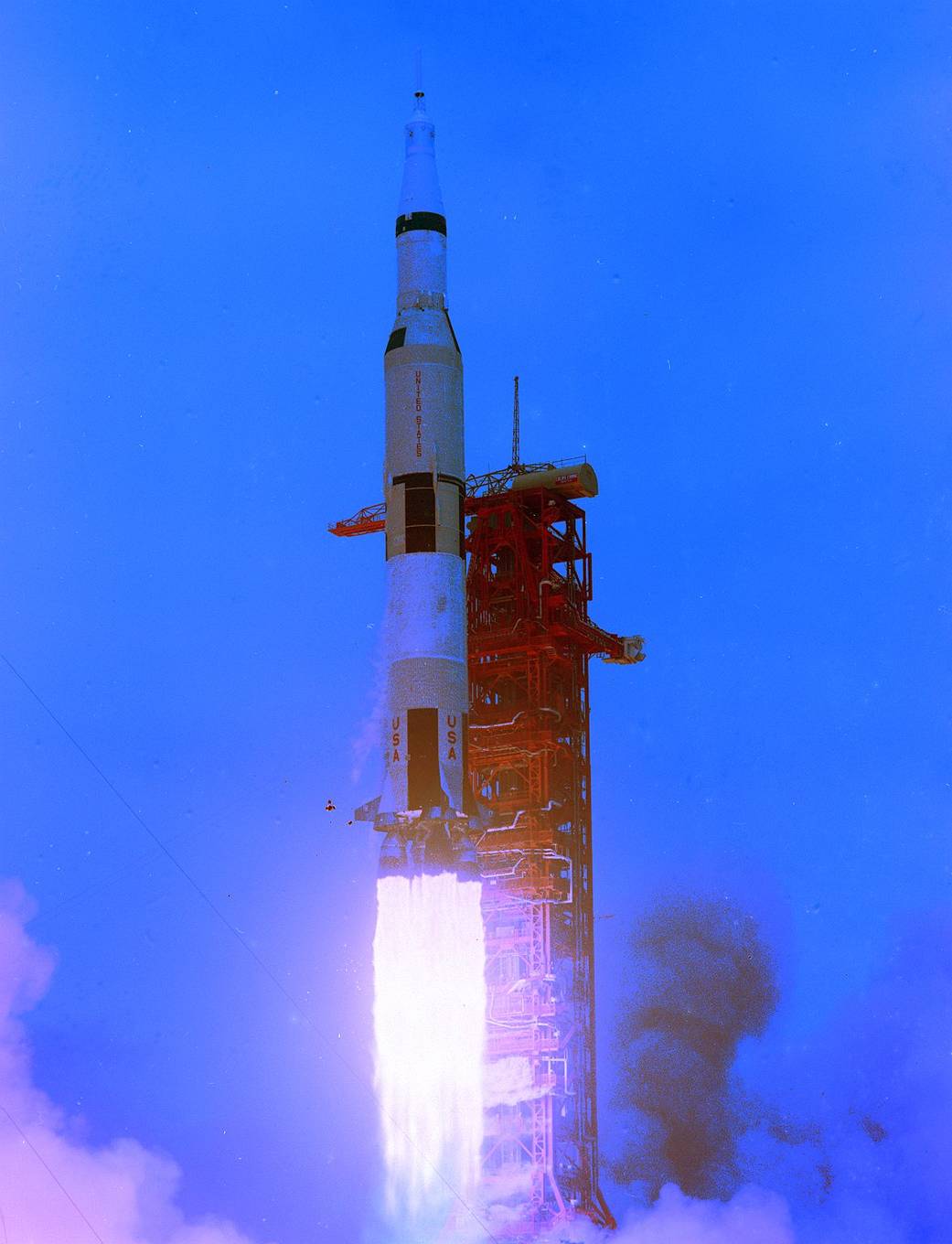 Apollo 10 launch. The Saturn V lifts from the launch pad in a blaze of fire.