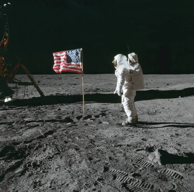 Buzz Aldrin salutes the flag