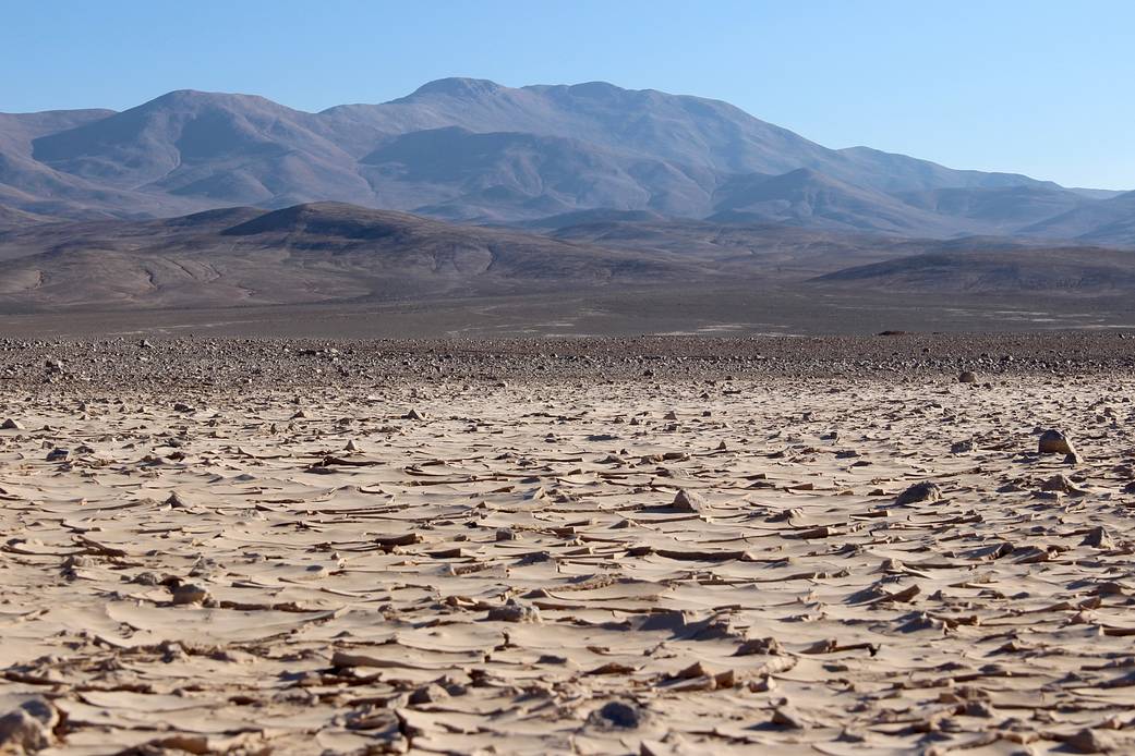 The features in the foreground, taken six months after a rain event, resemble a muddy puddle that has dried up.
