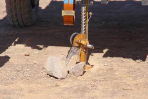 A spinning brush sweeps soil off the ARADS rover’s drill into a sample jar.