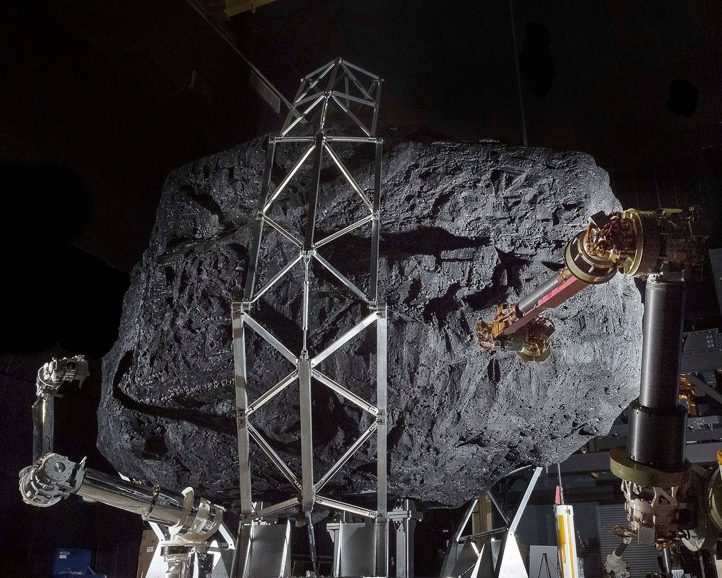Prototype robotic capture arms with mock asteroid boulder
