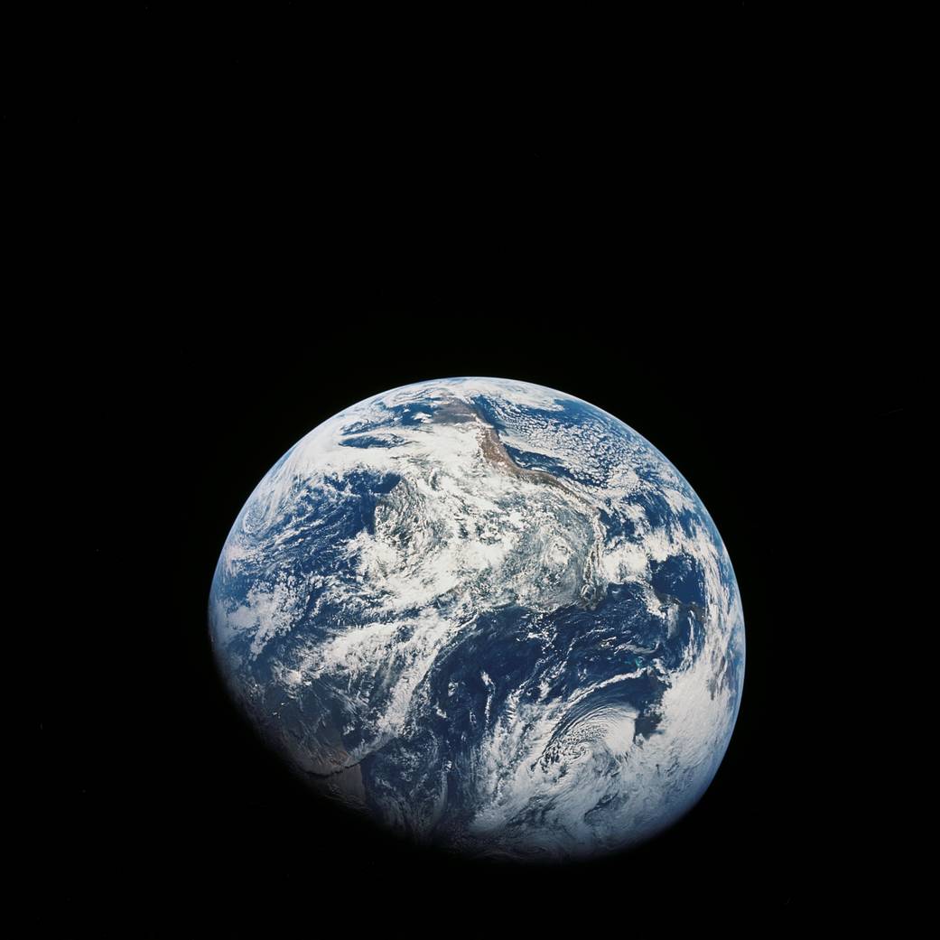 Earth photographed from lunar orbit with Western hemisphere visible