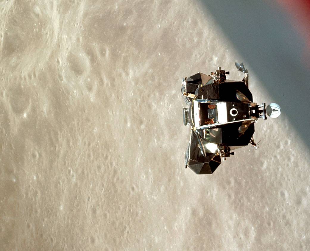 The Apollo 10 Lunar Module Ascends toward the Command and Service Module, backdropped by the Moon's surface.