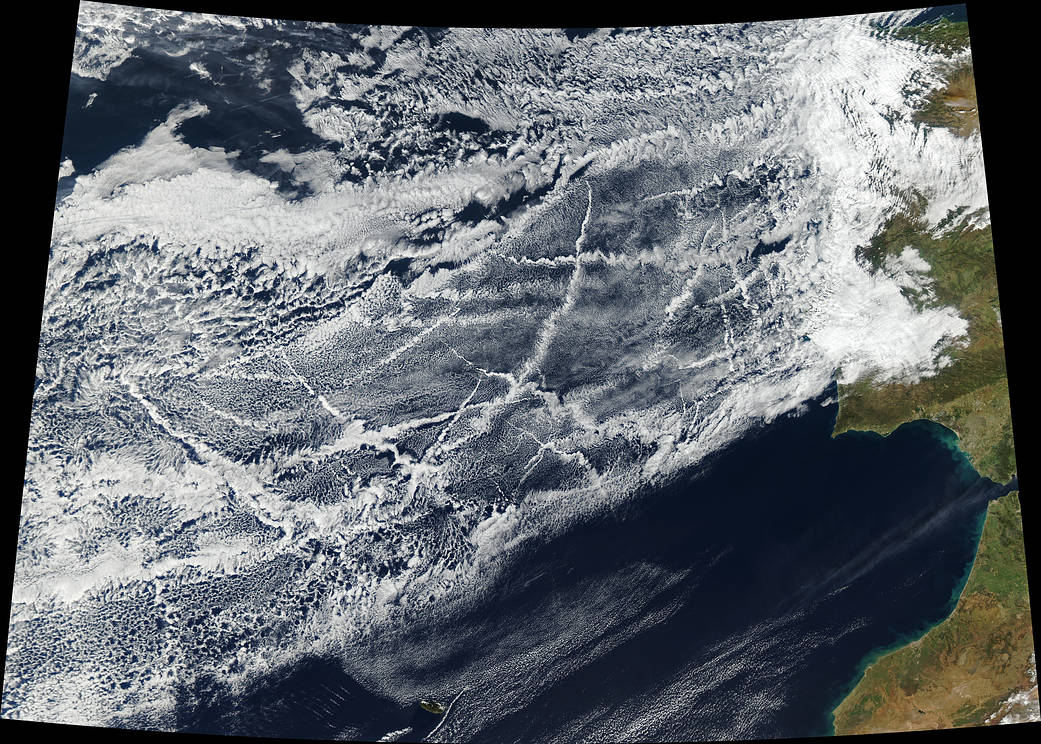 Ships churning through the Atlantic Ocean produced this patchwork of bright, criss-crossing cloud trails