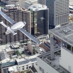 Artist's concept of various types of flying vehicles operating in an urban environment