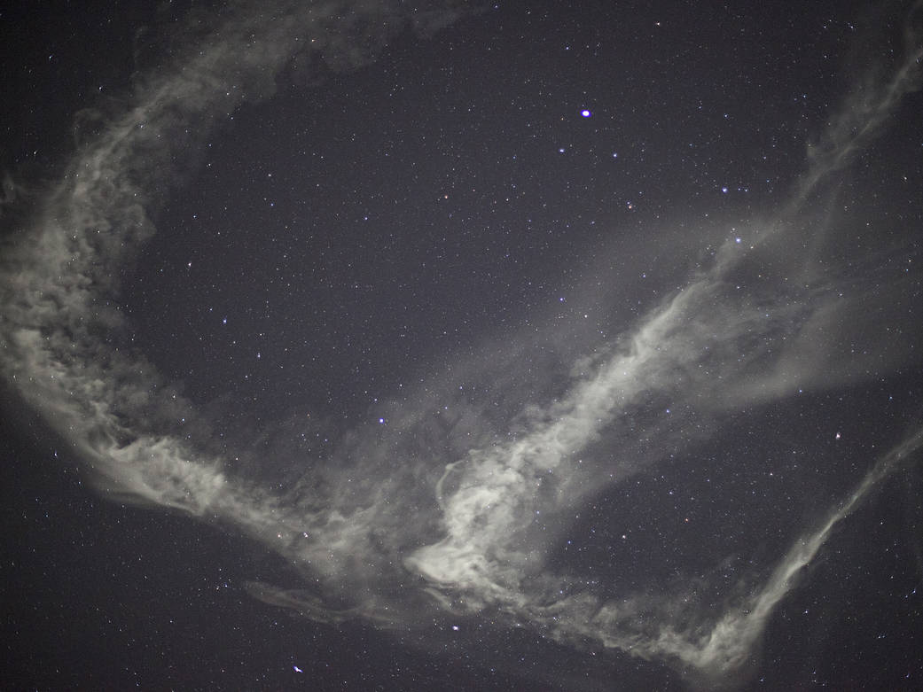 milky, white clouds at the edge of space