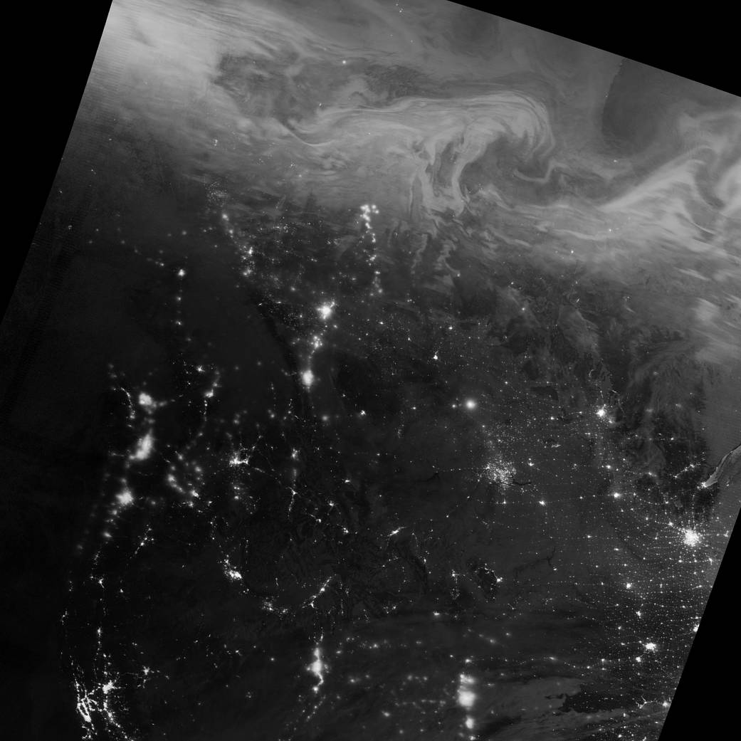 Nighttime image of Canada showing lights of aurora and cities