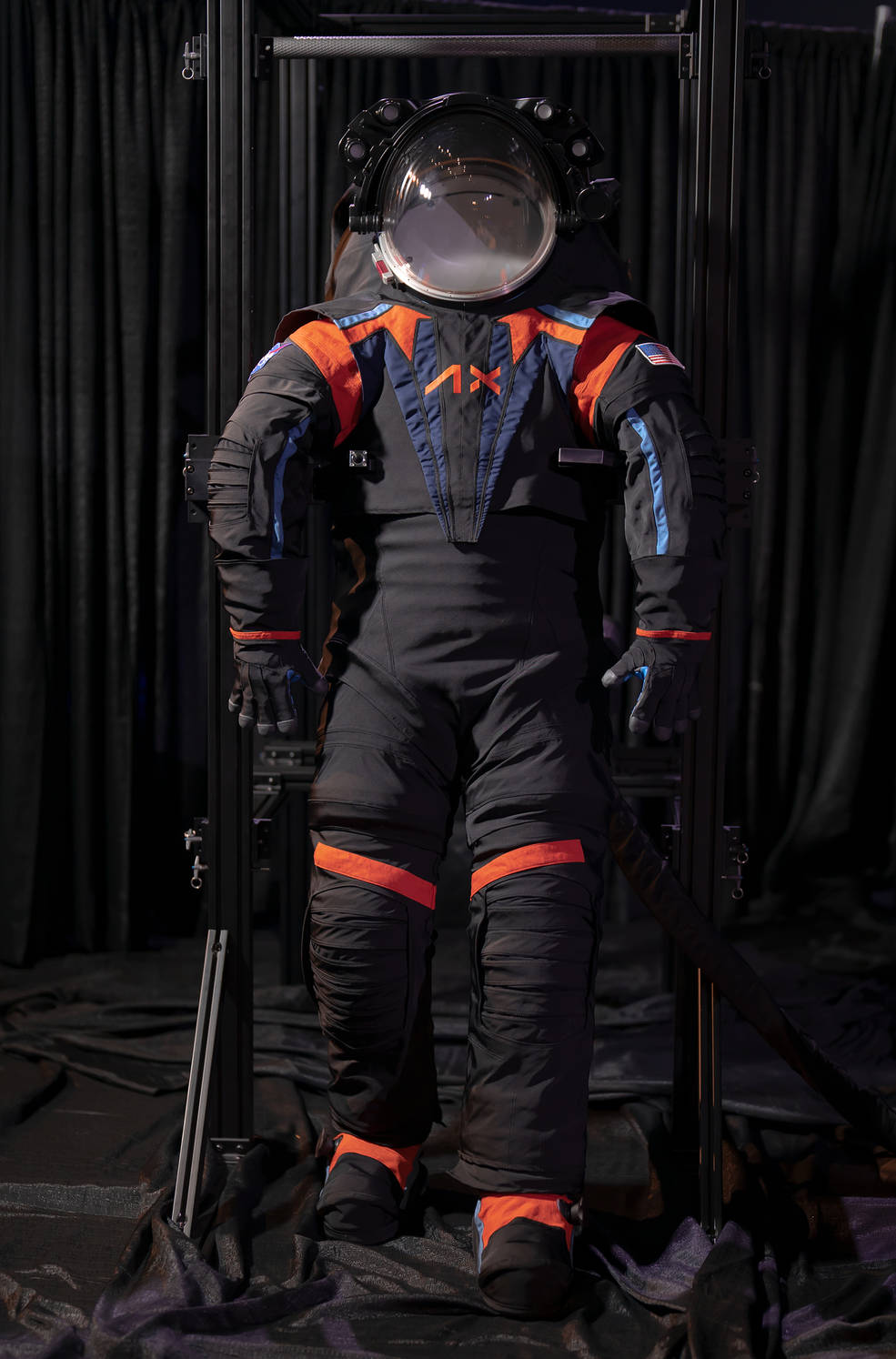 The Artemis III spacesuit prototype, the AxEMU. Though this prototype uses a dark gray cover material, the final version will likely be all-white when worn by NASA astronauts on the Moon’s surface. Credit: Axiom Space 