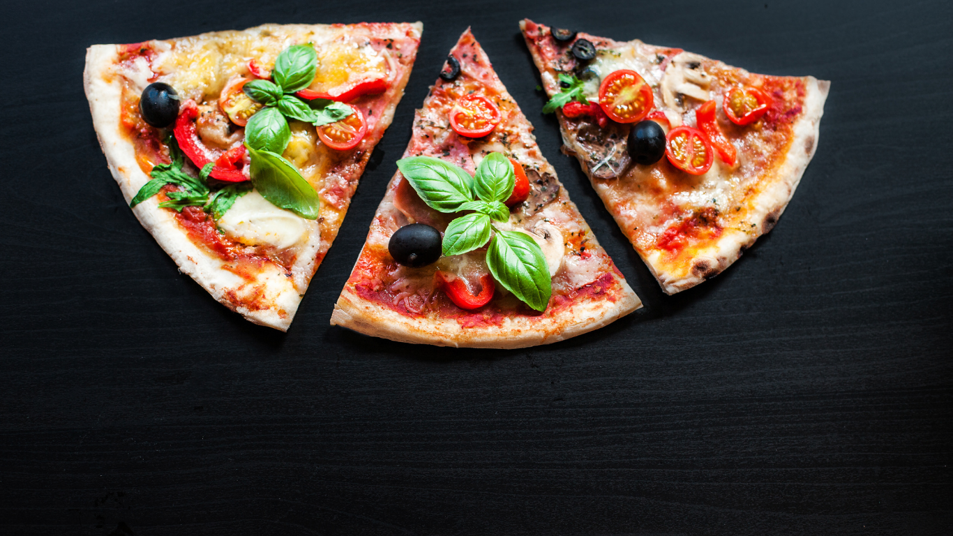 three slices of artisanal pizza on a black background