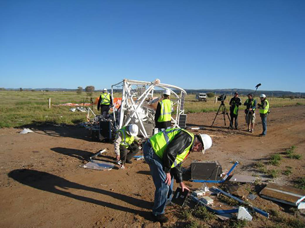 Project personnel recover a balloon