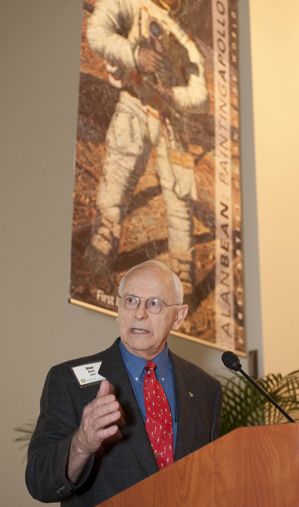 NASA Apollo 12 Astronaut and artist Alan Bean gives remarks at the opening of the exhibit "Alan Bean: Painting Apollo, First Art