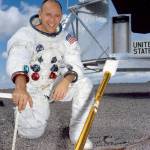 Astronaut Alan Bean poses for a portrait in front of a mock-up of the Lunar Module.