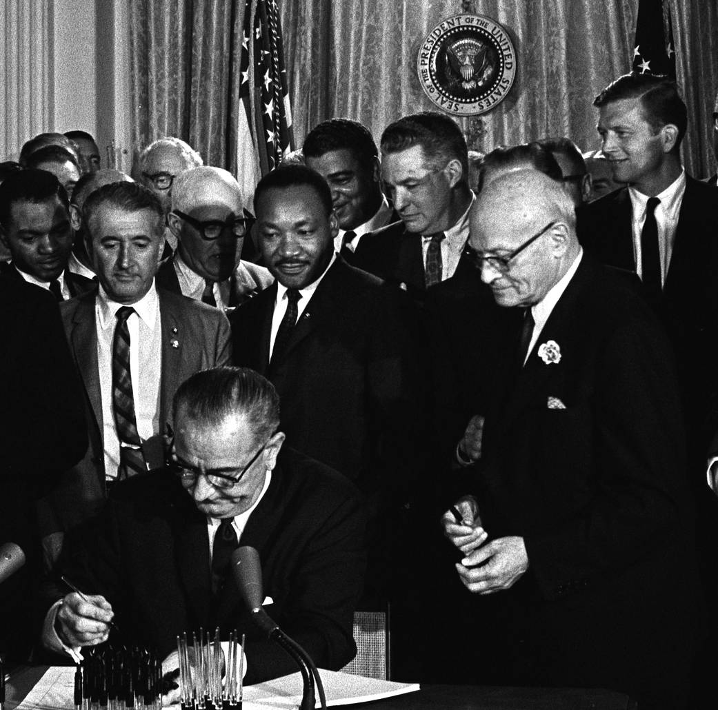 President Lyndon B. Johnson signing the Civil Rights on July 2, 1964.