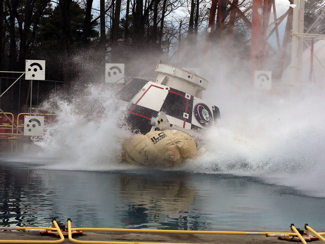 Test model of crew spacecraft drops into water basin