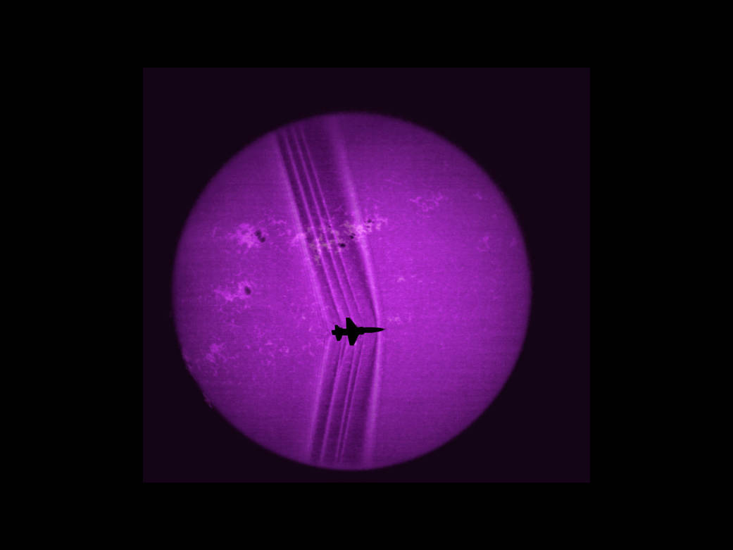 Using the solar disk as a backdrop researchers processed this image to reveal shock waves created by a supersonic T-38C.