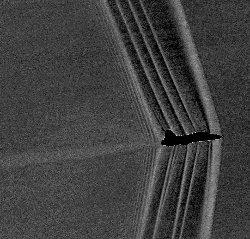 Shockwaves produced by a U.S. Air Force Test Pilot School T-38 banking at Mach 1.05.