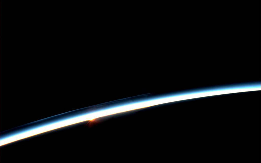 On July 30, 2013, Expedition 36 Flight Engineer Karen L. Nyberg of NASA took this photograph of a sunrise from the International