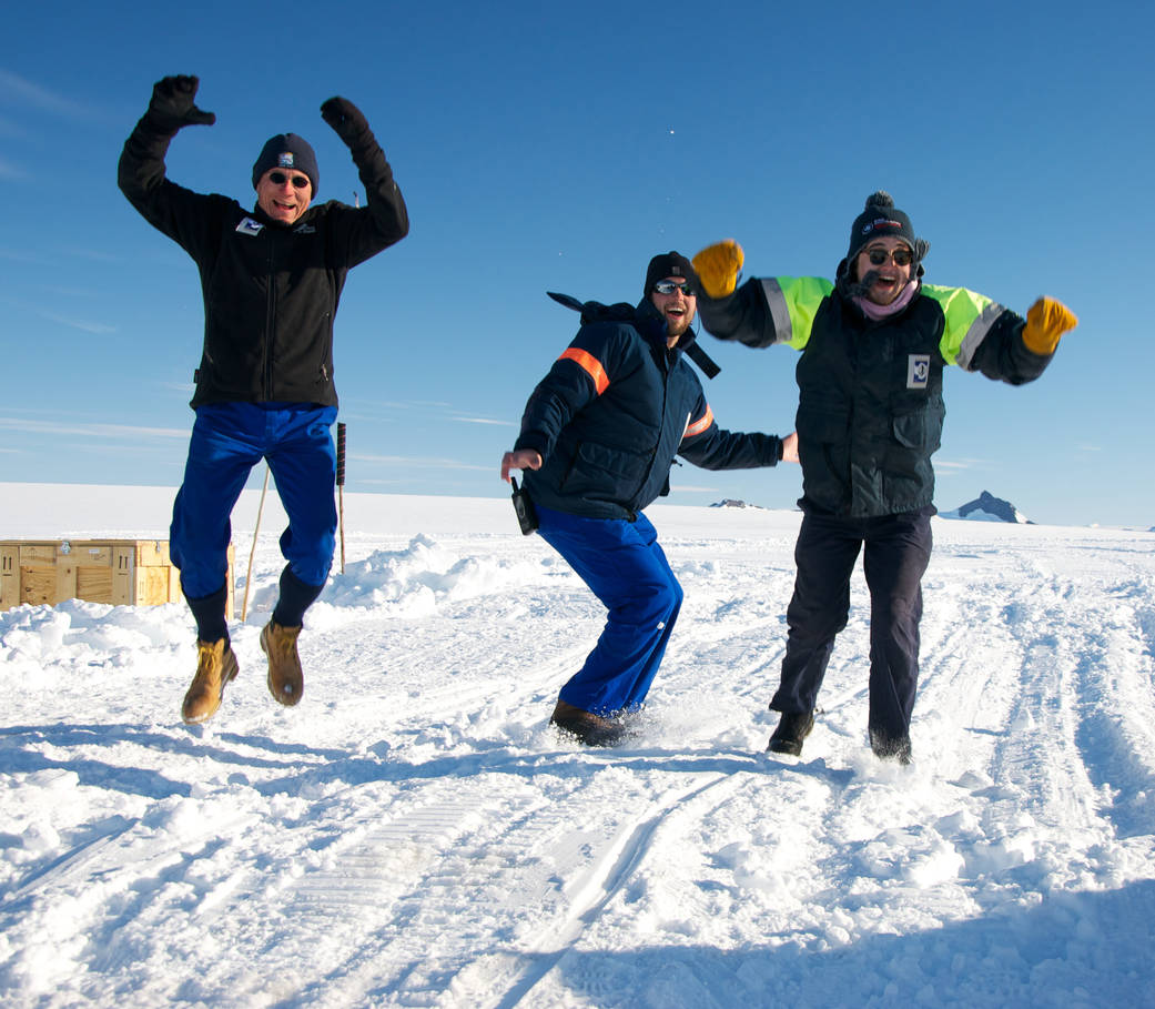 Members of the BARREL team in Antarctica jump up and down in what they call the Low Wind Dance as they hope for the low wind con