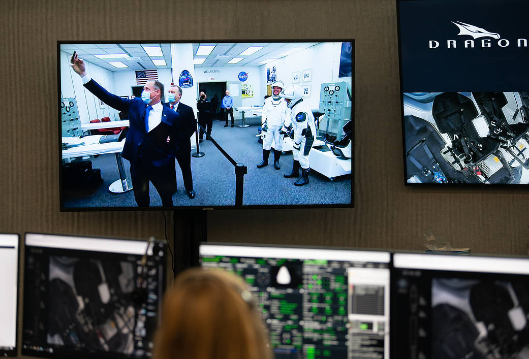 NASA AdministratorJim Bridenstine and NASA Deputy Administrator Jim Morhard are seen on a monitor inside firing room four.