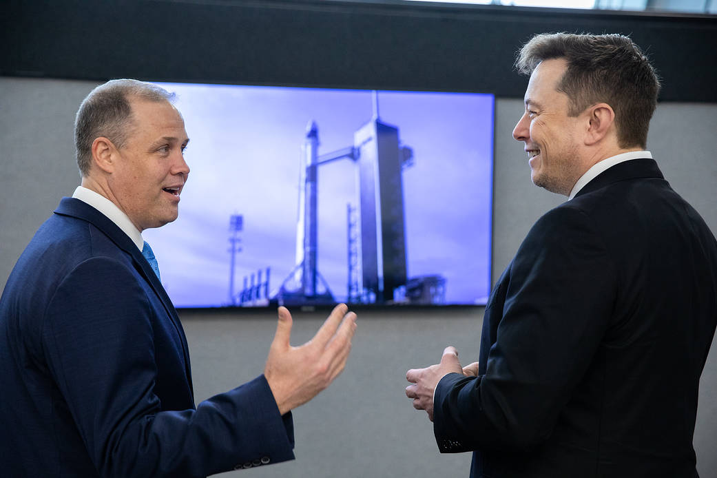 NASA Administrator Jim Bridenstine, left, and SpaceX Chief Engineer Elon Musk converse before the uncrewed In-Flight Abort Test.