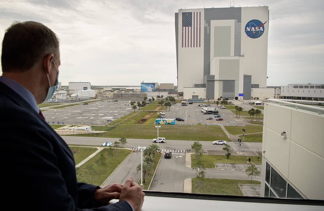 NASA Administrator Jim Bridenstine watches as NASA astronauts Douglas Hurley and Robert Behnken return to the Neil A. Armstrong 