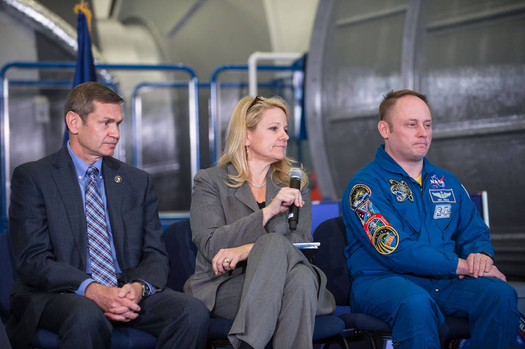 Gwynne Shotwell, SpaceX President and Chief Operating Officer, center, Boeing's John Elbon, left, and NASA astronaut Mike Fincke