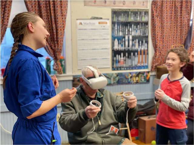 After a successful ISS inspired truss build, Challenger Learning Center’s Sarah Raymond-Boyan helps David and family try out Virtual Reality for the first time with Mission ISS’s spacewalk!