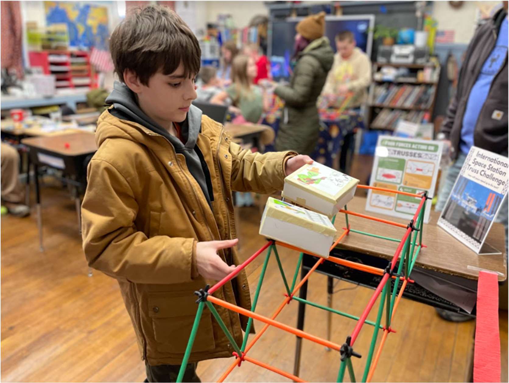 Cruz puts his International Space Station inspired truss structure to the test! It passed the length requirement, now how will it hold up to bearing a load?
